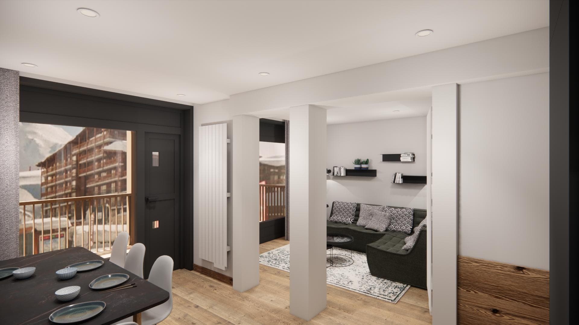 Wohnzimmer mit Ecksofa und Blick auf die Pisten