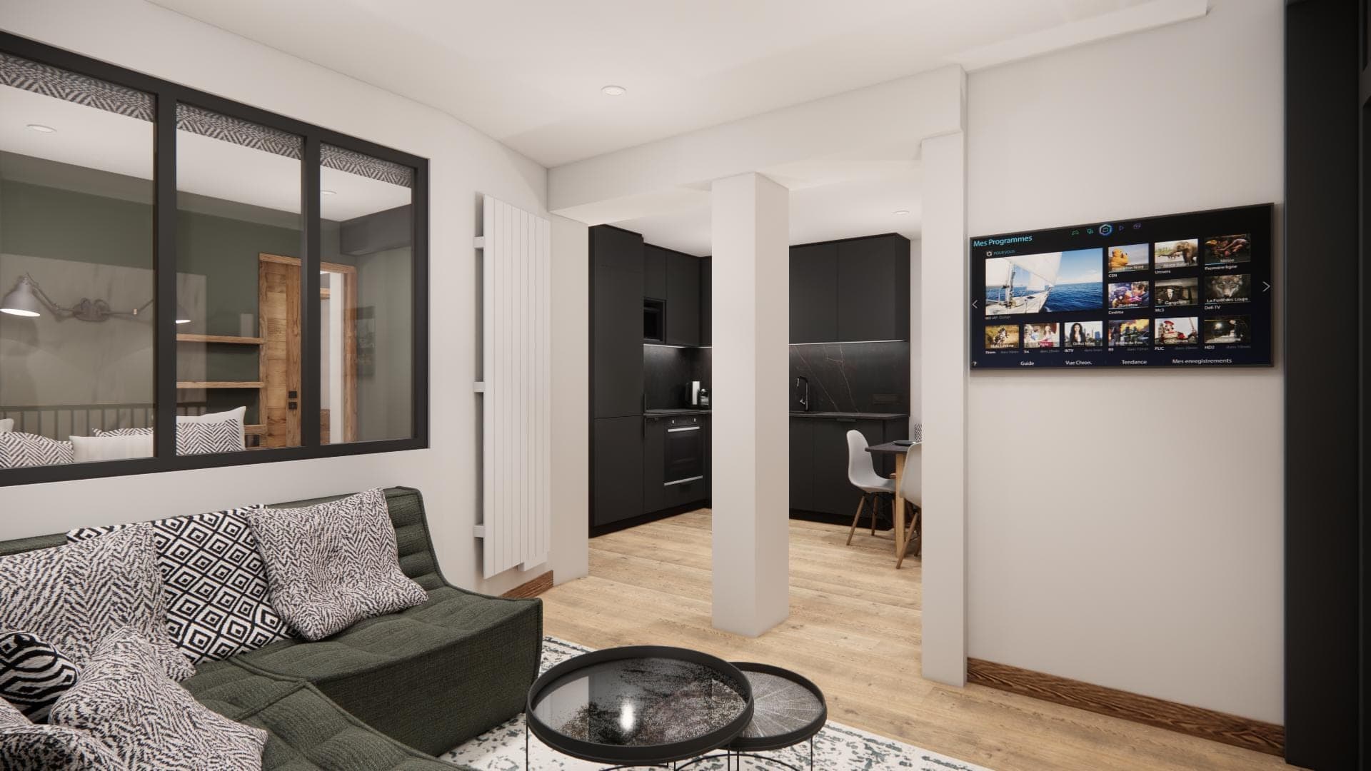 Wohnzimmer mit Ecksofa und Blick auf die Pisten